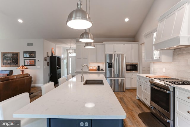 17 Beckleys Cor, Lebanon, PA 17042 - kitchen featuring appliances with stainless steel finishes, backsplash, white cabinets, light wood-type flooring, and recessed lighting