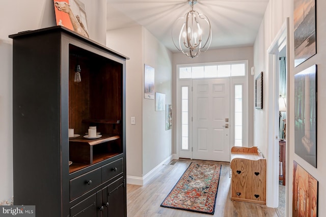 17 Beckleys Cor, Lebanon, PA 17042 - foyer entrance with healthy amount of natural light, a chandelier, and light wood-style floors