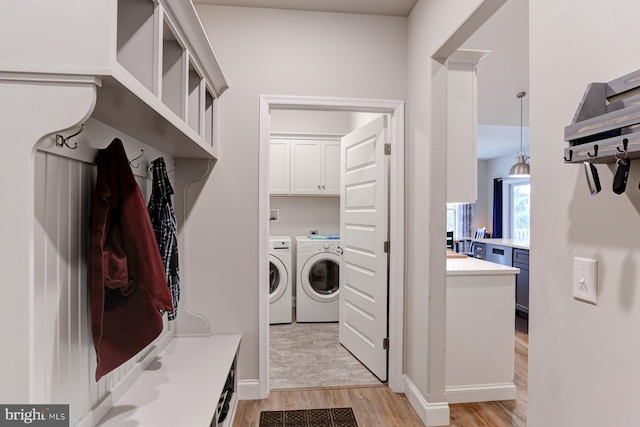 17 Beckleys Cor, Lebanon, PA 17042 - washroom featuring separate washer and dryer, cabinet space, and light wood-style flooring