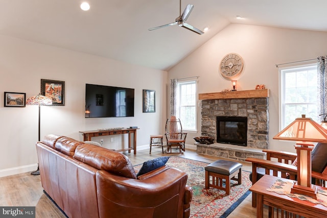 17 Beckleys Cor, Lebanon, PA 17042 - living area featuring ceiling fan, high vaulted ceiling, a stone fireplace, and light wood finished floors