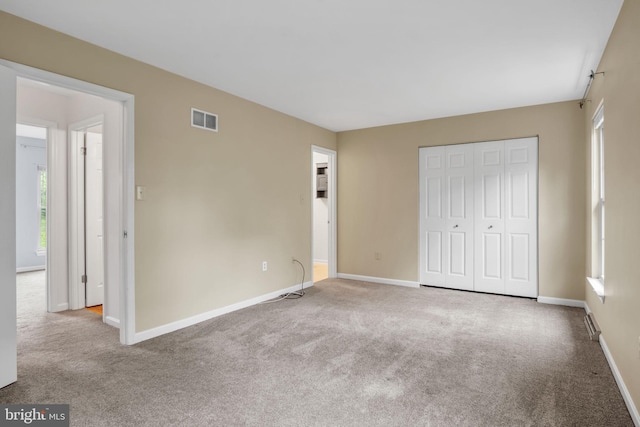 1773 Kings Arms Ct, New Cumberland, PA 17070 - unfurnished bedroom with carpet floors, multiple windows, and a closet
