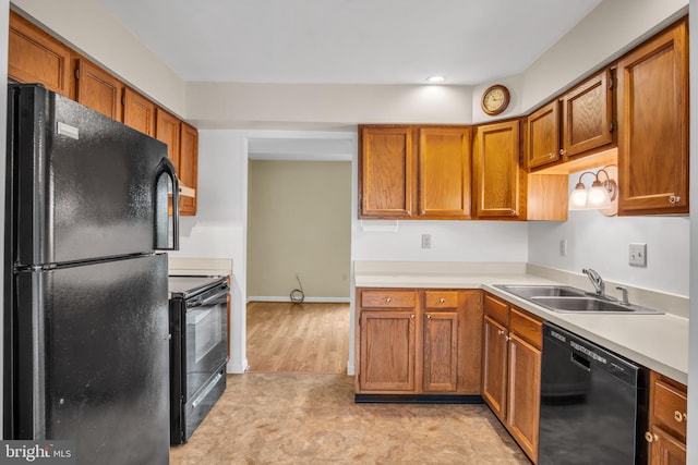 1773 Kings Arms Ct, New Cumberland, PA 17070 - kitchen with black appliances, light countertops, brown cabinets, and recessed lighting