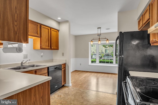 1773 Kings Arms Ct, New Cumberland, PA 17070 - kitchen featuring dishwasher, brown cabinets, light countertops, hanging light fixtures, and range with electric stovetop