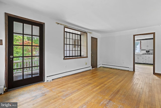 210 S Pennell Rd, Media, PA 19063 - spare room with a baseboard radiator, a baseboard heating unit, and hardwood / wood-style floors