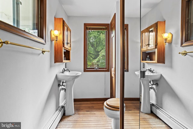 210 S Pennell Rd, Media, PA 19063 - bathroom with a baseboard heating unit and hardwood / wood-style floors