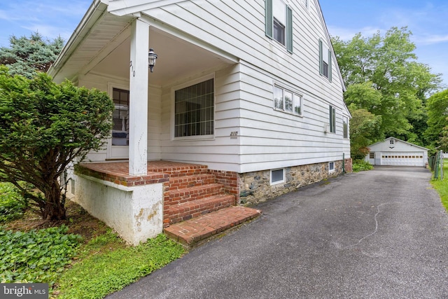 210 S Pennell Rd, Media, PA 19063 - view of home's exterior with an outdoor structure and a detached garage