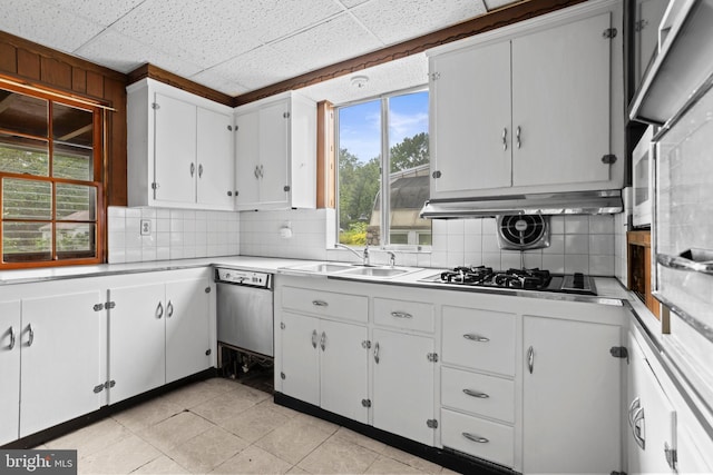210 S Pennell Rd, Media, PA 19063 - kitchen featuring gas stovetop, decorative backsplash, light countertops, white cabinetry, and a paneled ceiling