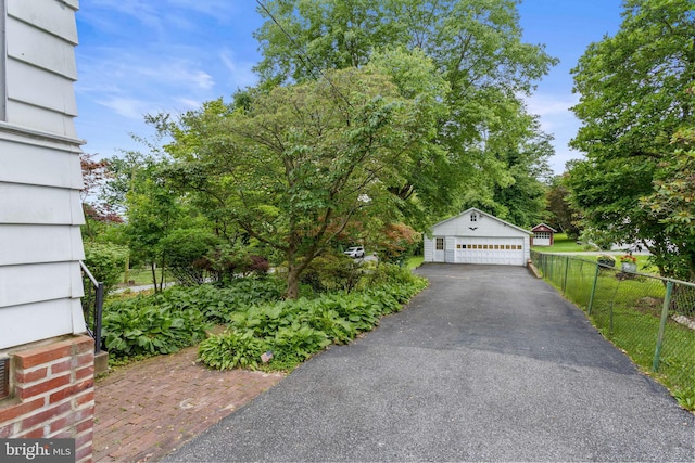 210 S Pennell Rd, Media, PA 19063 - view of front of home with a garage and an outdoor structure