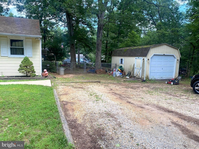 926 Sycamore Ln, Williamstown, NJ 08094 - view of yard with driveway, an outbuilding, and a garage