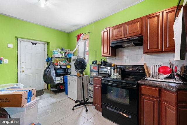 523 W Venango St, Philadelphia, PA 19140 - kitchen with black range with electric stovetop, under cabinet range hood, backsplash, and light tile patterned floors