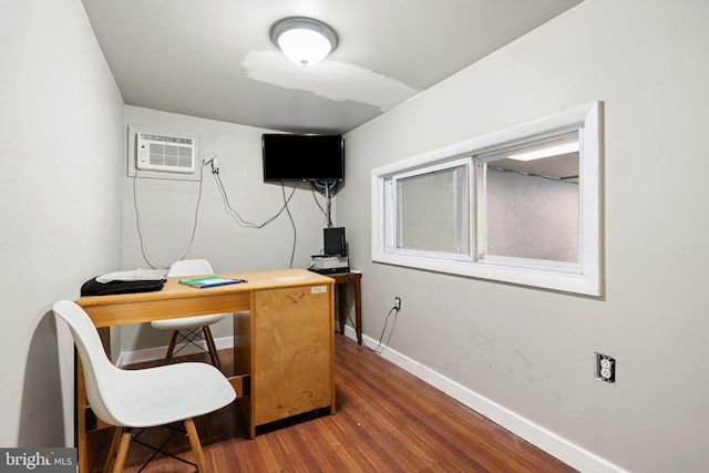 523 W Venango St, Philadelphia, PA 19140 - office area featuring a wall unit AC and dark wood finished floors