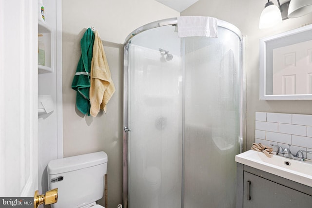 523 W Venango St, Philadelphia, PA 19140 - full bathroom featuring vanity, a shower stall, tile walls, and backsplash