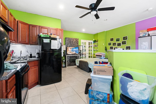 523 W Venango St, Philadelphia, PA 19140 - kitchen featuring black appliances, dark countertops, light tile patterned flooring, backsplash, and ceiling fan