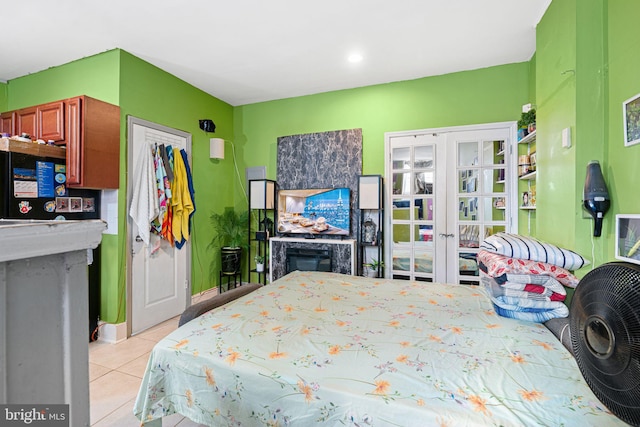 523 W Venango St, Philadelphia, PA 19140 - bedroom featuring light tile patterned floors, a fireplace, french doors, and recessed lighting