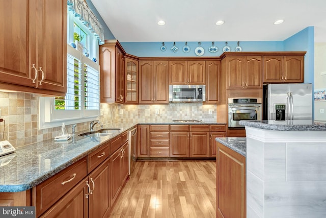 5230 Canyon Creek Way, Haymarket, VA 20169 - kitchen with stainless steel appliances, brown cabinetry, stone counters, light wood-style floors, and recessed lighting