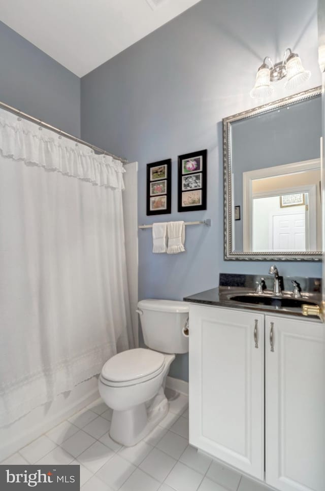 5230 Canyon Creek Way, Haymarket, VA 20169 - bathroom featuring vanity, shower / tub combo with curtain, and tile patterned flooring