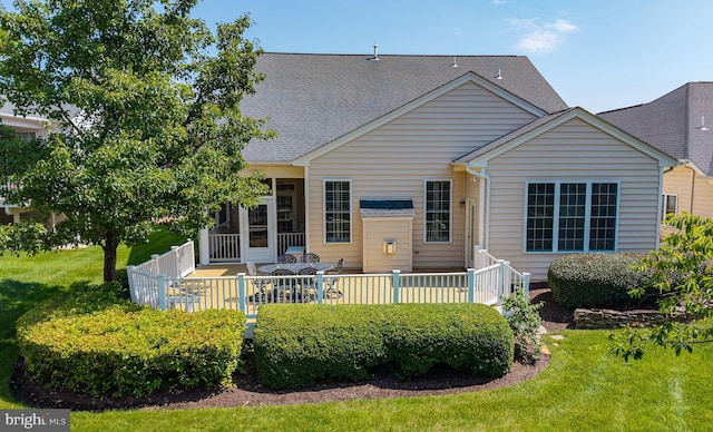 5230 Canyon Creek Way, Haymarket, VA 20169 - rear view of property with roof with shingles, a wooden deck, a yard, and a sunroom