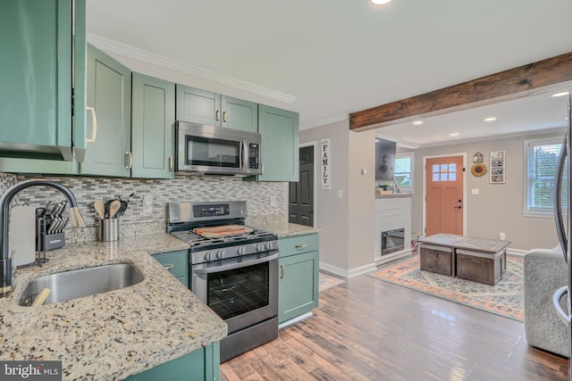 46 Avalon Ave, Dundalk, MD 21222 - kitchen featuring stainless steel appliances, green cabinetry, crown molding, recessed lighting, and beamed ceiling