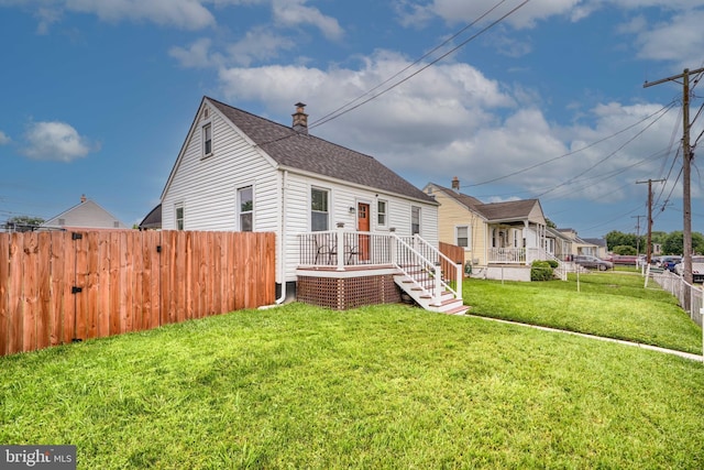 46 Avalon Ave, Dundalk, MD 21222 - view of front of home with a shingled roof and a wooden deck