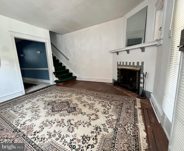 217 Bartlett Ave, Sharon Hill, PA 19079 - living area with wood finished floors, a fireplace, and stairs
