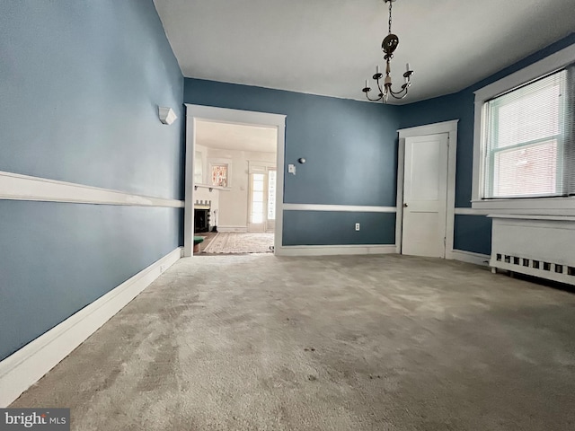 217 Bartlett Ave, Sharon Hill, PA 19079 - empty room featuring a chandelier and carpet floors