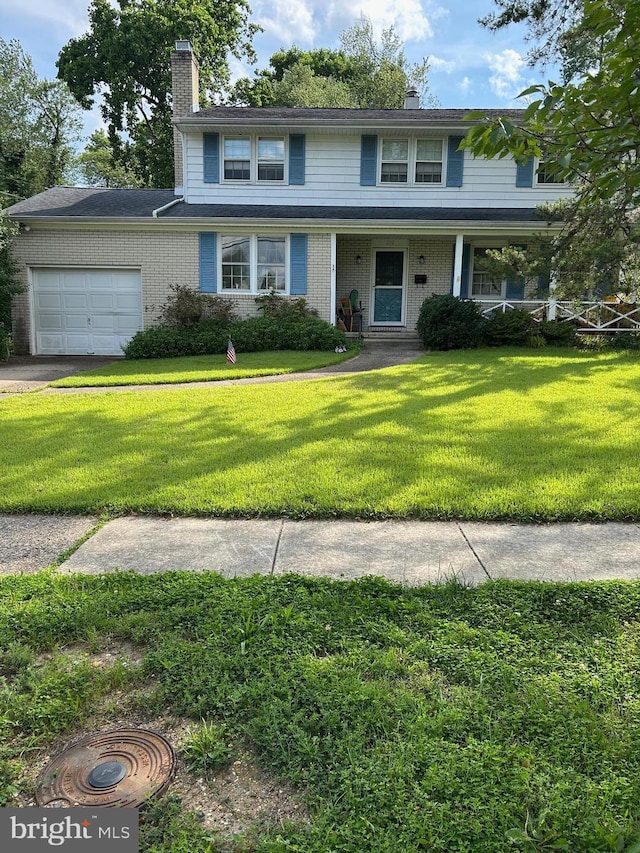 212 Walt Whitman Blvd, Cherry Hill, NJ 08003 - traditional home with a chimney, a garage, a front lawn, brick siding, and a porch