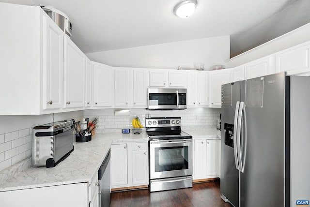 106 Alex Dr, Madison Heights, VA 24572 - kitchen with appliances with stainless steel finishes, vaulted ceiling, backsplash, white cabinets, and dark wood finished floors