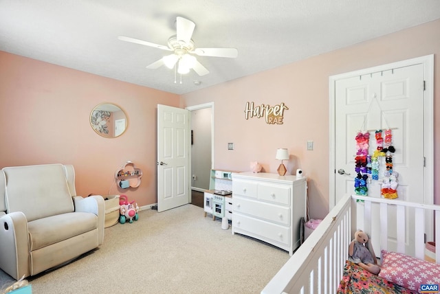 106 Alex Dr, Madison Heights, VA 24572 - bedroom featuring a crib, light carpet, and a ceiling fan