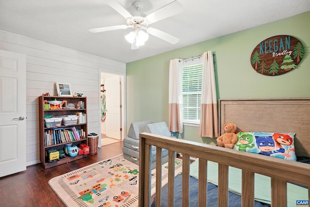106 Alex Dr, Madison Heights, VA 24572 - bedroom with wood finished floors, a ceiling fan, and wooden walls