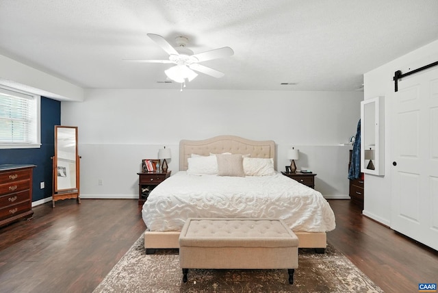 106 Alex Dr, Madison Heights, VA 24572 - bedroom with a barn door, wood finished floors, and ceiling fan