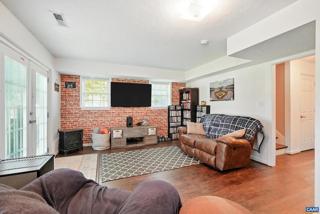 106 Alex Dr, Madison Heights, VA 24572 - living area featuring a wood stove and wood finished floors