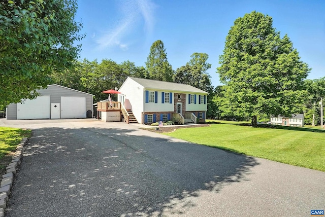 106 Alex Dr, Madison Heights, VA 24572 - raised ranch featuring an outbuilding, a garage, a front yard, and brick siding