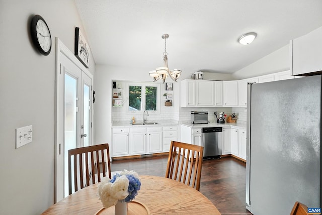 106 Alex Dr, Madison Heights, VA 24572 - kitchen featuring freestanding refrigerator, stainless steel dishwasher, a chandelier, decorative backsplash, and light countertops
