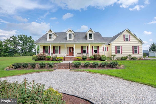 1211 Dexter Corner Rd, Townsend, DE 19734 - cape cod house featuring covered porch, a front lawn, and a shingled roof