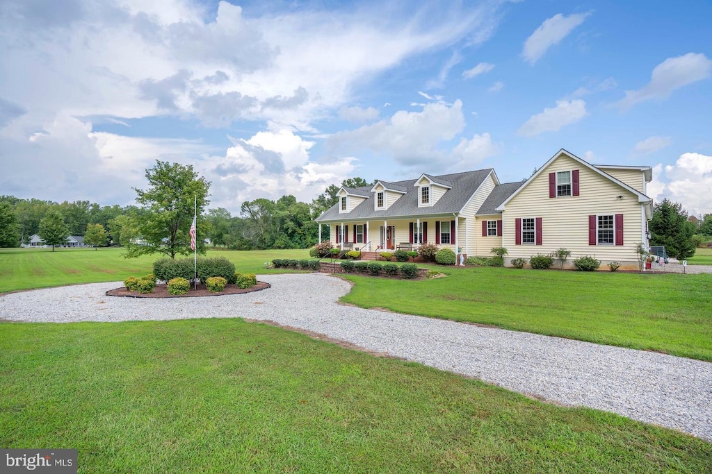 1211 Dexter Corner Rd, Townsend, DE 19734 - new england style home featuring a porch and a front yard