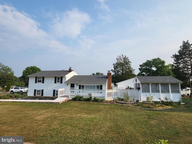 2900 Silver Spruce Ln, Abingdon, MD 21009 - back of house with a yard, a wooden deck, a sunroom, and a chimney
