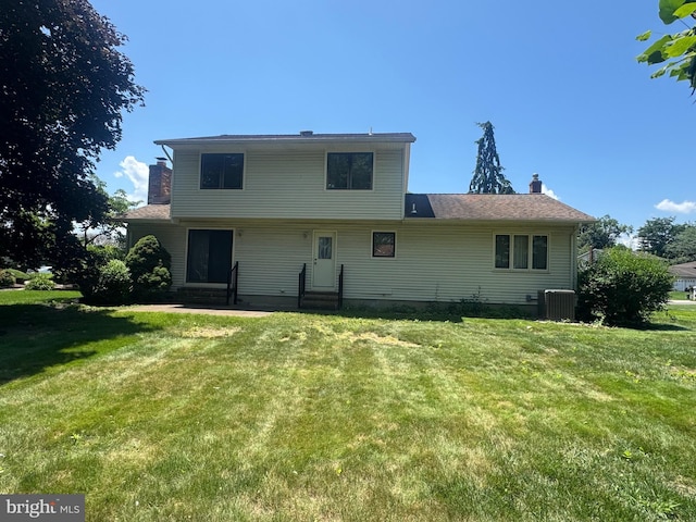 21 Stratton Dr, Hamilton, NJ 08690 - back of house featuring a chimney and a lawn