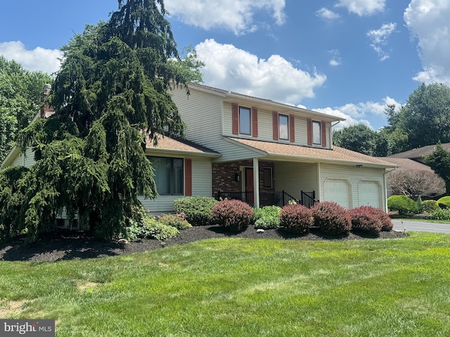 21 Stratton Dr, Hamilton, NJ 08690 - view of front facade featuring a front lawn, a garage, and a porch