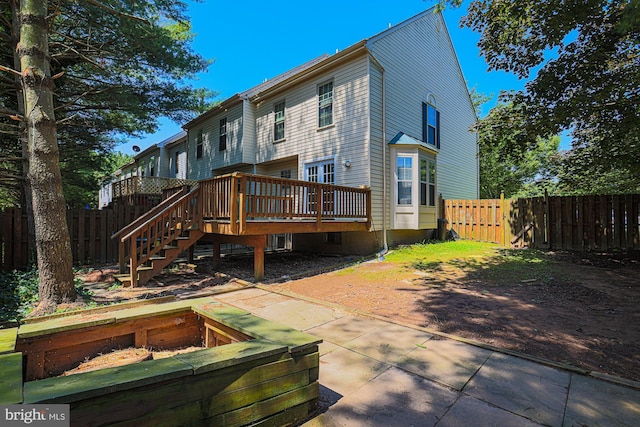 4845 Wainwright Cir, Owings Mills, MD 21117 - rear view of house featuring a wooden deck and stairs