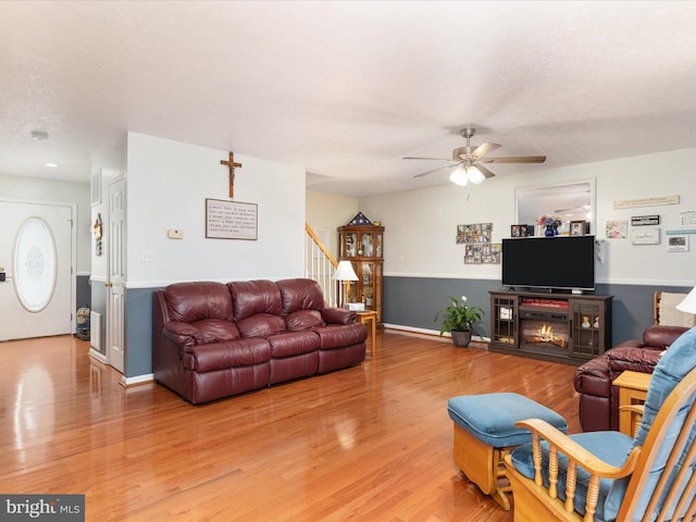 31 Westminster Dr, Front Royal, VA 22630 - living room with a ceiling fan, stairway, light wood finished floors, and a textured ceiling