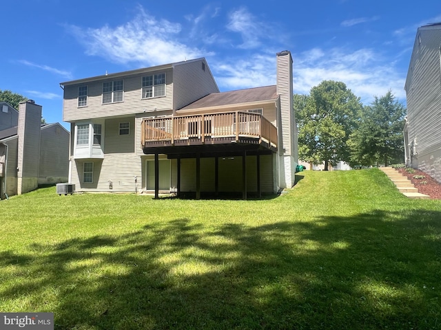 9802 Fox Run Dr, Clinton, MD 20735 - rear view of property featuring a wooden deck and a yard