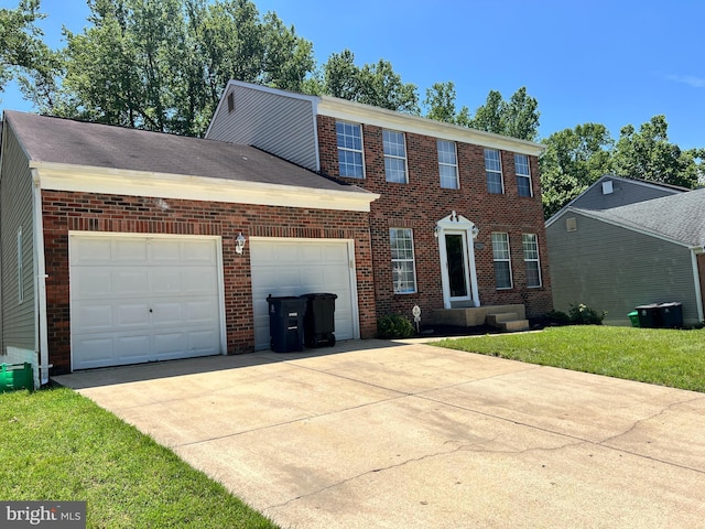 9802 Fox Run Dr, Clinton, MD 20735 - view of front of property featuring concrete driveway, a garage, brick siding, and a front yard