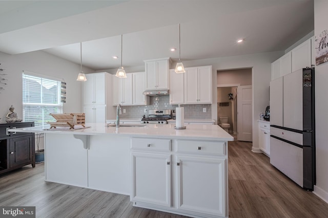 303 Jasper Way, Middletown, DE 19709 - kitchen featuring freestanding refrigerator, stainless steel gas stove, wood finished floors, backsplash, and recessed lighting