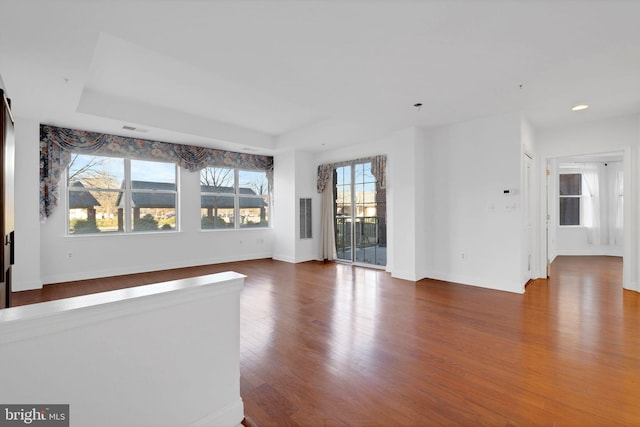 2019 Windrow Dr, Princeton, NJ 08540 - unfurnished living room featuring dark wood-style floors, a tray ceiling, and recessed lighting