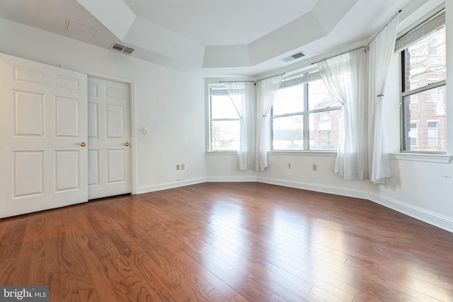 2019 Windrow Dr, Princeton, NJ 08540 - unfurnished bedroom featuring a raised ceiling and dark wood-type flooring