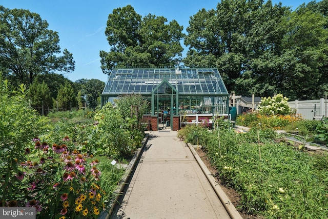 2019 Windrow Dr, Princeton, NJ 08540 - rear view of property with a greenhouse, an outbuilding, a garden, and brick siding