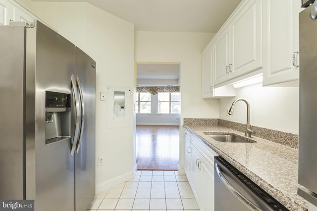 2019 Windrow Dr, Princeton, NJ 08540 - kitchen featuring stainless steel appliances, white cabinetry, light tile patterned floors, and light stone countertops