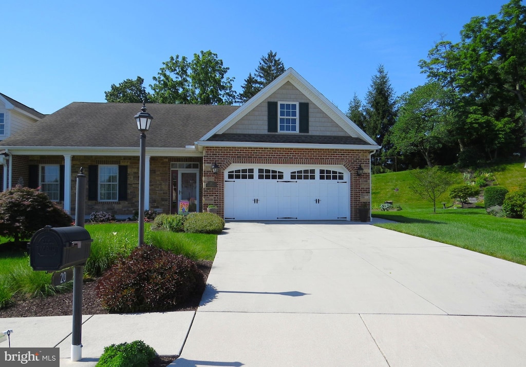 20 Digges Ct, Littlestown, PA 17340 - view of front of property featuring a garage, a front lawn, driveway, and brick siding