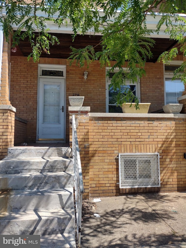 2714 E Biddle St, Baltimore, MD 21213 - property entrance featuring brick siding