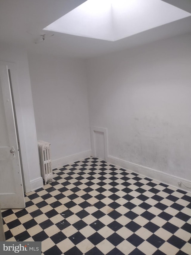 2714 E Biddle St, Baltimore, MD 21213 - empty room featuring light flooring and radiator